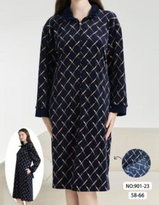 Desk with leather desk pad, walnut desk organizer, wireless keyboard and mouse, and porcelain mug.